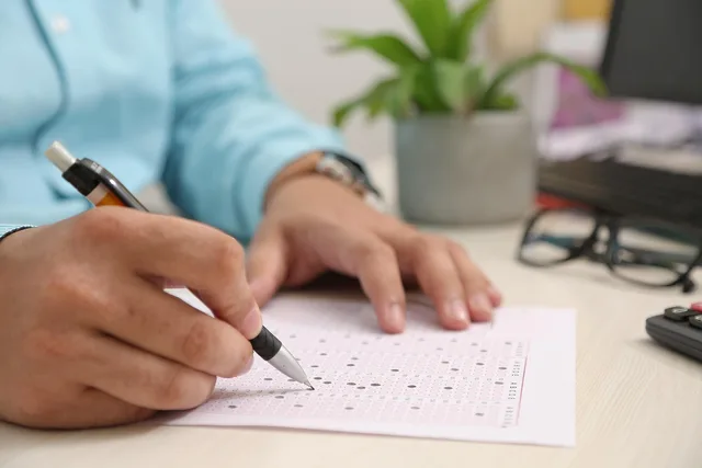test paper, answering, hand, note, filling sheet, filling form, test paper, test paper, test paper, test paper, test paper. What a marketing attribution launch review must evidence